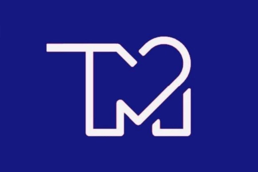 Logo de TecMed, un diseño minimalista compuesto por las iniciales del grupo y un corazón