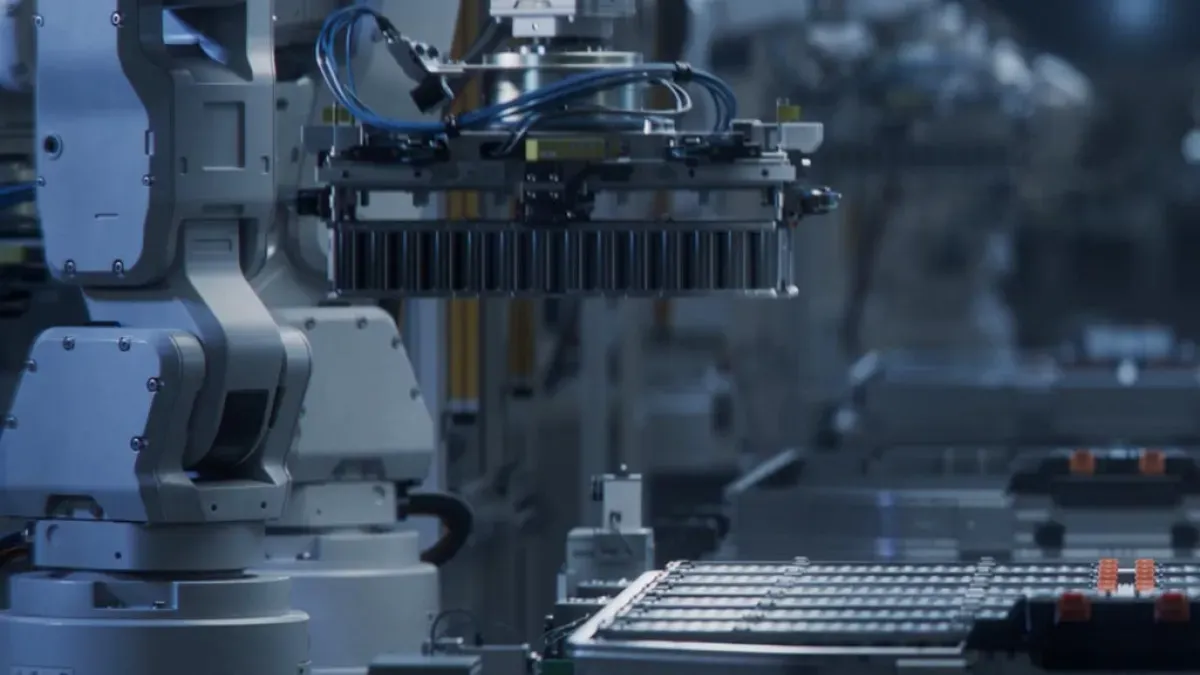 Robotic arm operating in an industrial or automation environment.