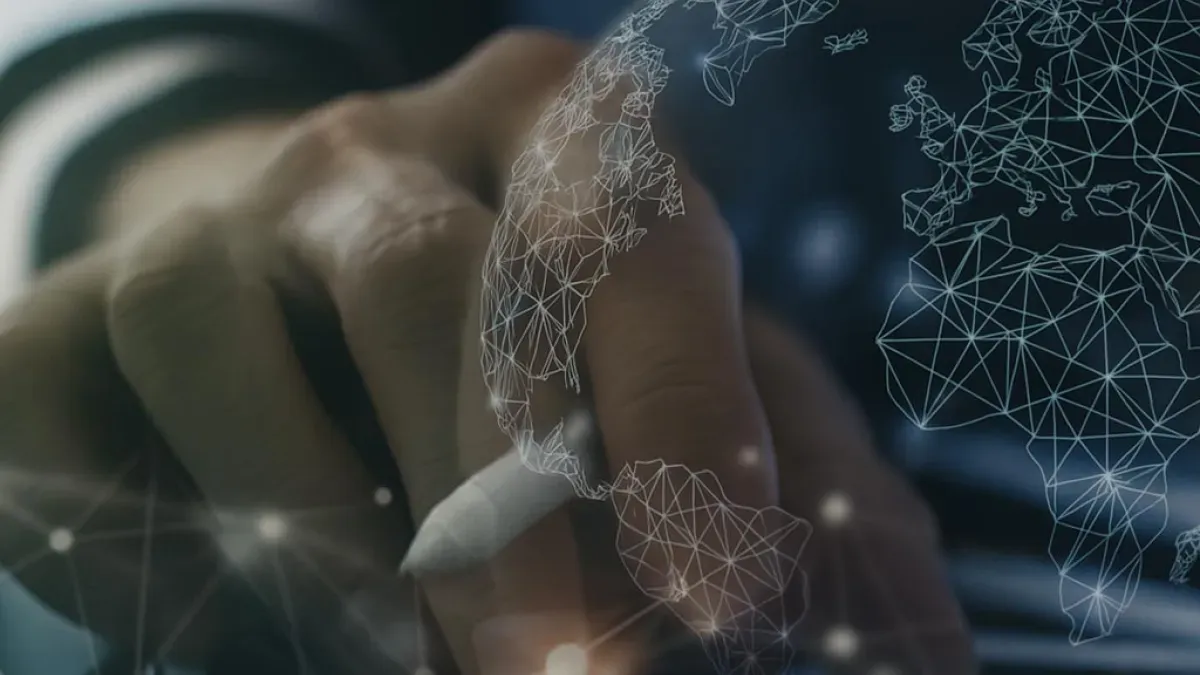 Hand using a digital pen on a screen, with an overlay of a globe connected by nodes and lines, symbolizing global technology and data analysis.